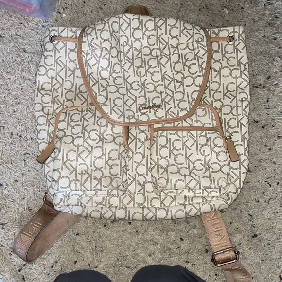Calvin Klein Handbags - Calvin Klein cream and tan backpack with adjustable straps